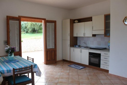  THE LIVING ROOM AND THE KITCHEN